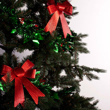 Load image into Gallery viewer, Holly tinsel wrapped around a tree decorated with red bows

