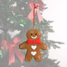 Load image into Gallery viewer, Gingerbread hanging decoration infront of a decorated Christmas tree
