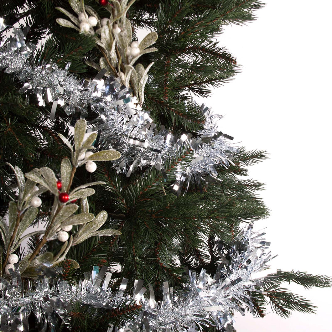 Snowflake tinsel wrapped around a tree decorated with picks