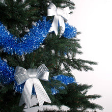 Load image into Gallery viewer, Ice blue tinsel wrapped around a tree decorated with silver bows
