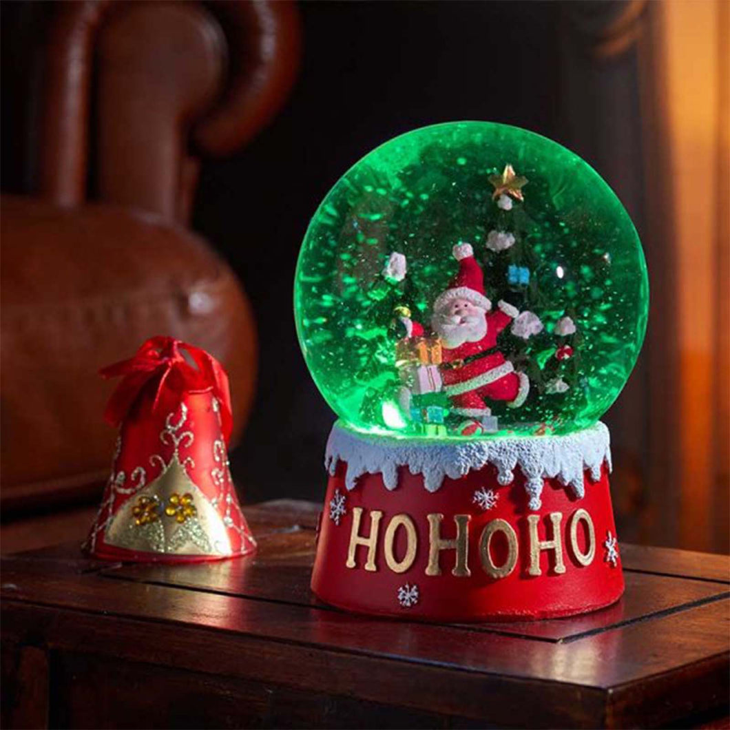 Santa snow globe lit up green with LED lights inside